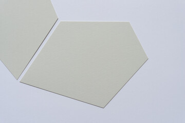 gray paper shapes on a light background