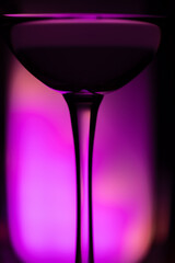Cocktail drink on a purple background. Selective focus.