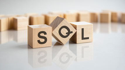 SQL - structured query language shot form on wooden block