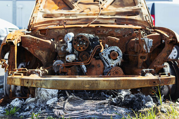 burnt engine in the car close-up. fire insurance concept