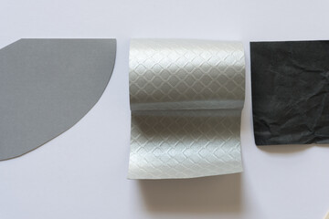 paper pieces on a flat paper surface (3d silver shape)