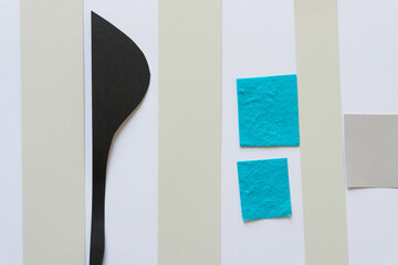 paper pieces on a flat paper surface (blue squares)