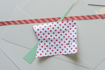 paper pieces on a flat paper surface (polka dots and stripes)