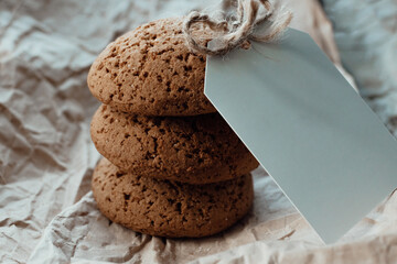 Bakery products with card for logo. Homemade cookies with sugar on a paper background. Background image, copy space.