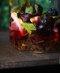 still life glass swith lemon and berry tea