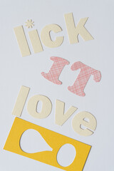 lick it love! (letters on paper with stencil exclamation mark)