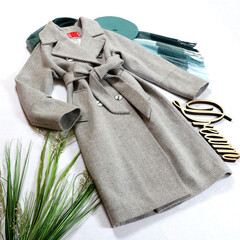 Stylish women's outfit, gray autumn coat on a white background. 