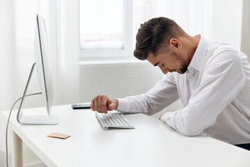 manager office worker in a white shirt emotions technologies