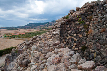 Fototapeta na wymiar Stone historic buildings named Nuraghi on the island of Sardinia in Italy.