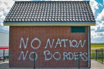 No Nation No Borders, graffiti on a utilitarian building in Lauwersoog, the Netherlands