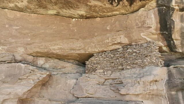 Aerial Indian cliff granary south Utah pan. Montezuma Canyon southern Utah. Ancient native American, Indian dwelling, kiva, house, cliff dwelling, granary,  rock art, hieroglyphs.