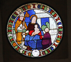 Madonna con santo vescovo e devoto; vetrata antica nella Chiesa di San Lanfranco a Pavia