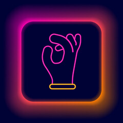 Glowing neon line Medical rubber gloves icon isolated on black background. Protective rubber gloves. Colorful outline concept. Vector