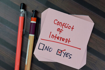Concept of Yes Result with Conflict of Interest write on sticky notes isolated on Wooden Table.