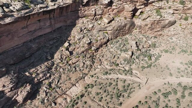 Aerial rocky cliff mountain south Utah descend. Montezuma Canyon southern Utah. Ancient native American, Indian dwelling, kiva, house, cliff dwelling, granary,  rock art, hieroglyphs.