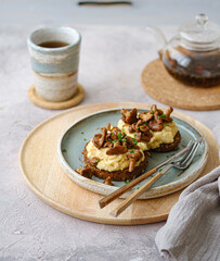 Cozy breakfast Scrambled eggs with chanterelle on buns with tea, copy space - 507380802