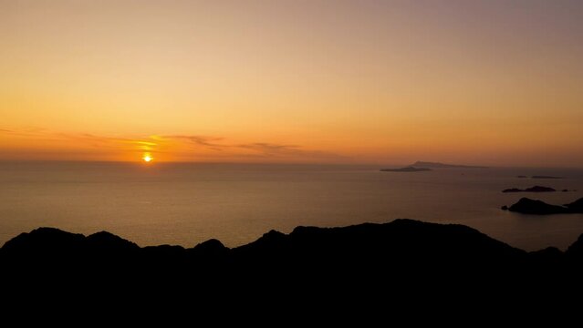 Aerial Hyperlapse of sunset into the mediterranean sea at Corfu, Greece