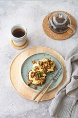 Cozy breakfast Scrambled eggs with chanterelle on buns with tea, copy space