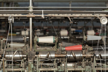 An old textile manufactory. Textile manufacturing. The work of textile processing machines.