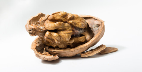 Walnuts are rounded, single-seeded stone fruits of the walnut tree. Cracking a nut.