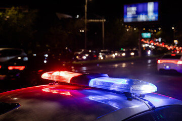 police car lights at night in city - obrazy, fototapety, plakaty