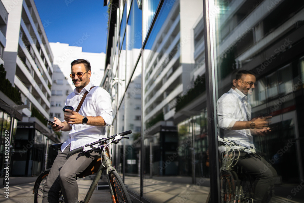 Wall mural Business man drinking coffe to go