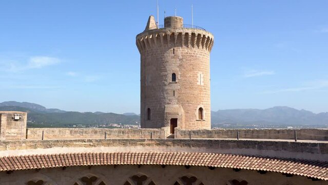 Inside view of the Bellver Castle in Palma de Mallorca - Spain. Tilt shot over the Archs on the first floor and the tower.