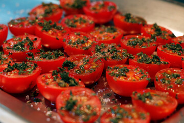sun dried tomatoes with herbs and oil in a hot surface