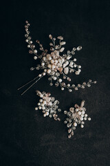 Women's earrings and hair accessory made of small crystals, pearls, pearls. Bride, wedding morning