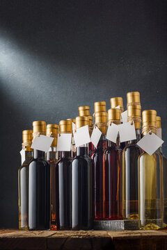 Wines assortment. Many 250 ml bottles of red, pink, white dry dessert wines with blank labels, mockup template. Vertical shot. Copy space