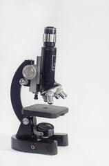 old analog microscope, mirror on white background with copy space