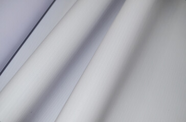 wavy texture of white flexion fabric with stripes. blank tarpaulin material for digital banner...