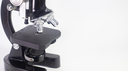 old analog microscope, mirror on white background with copy space