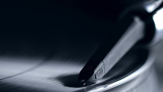 DJ headshell on spinning record on turntable. Listening the music