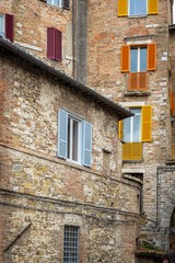 Old houses facade, in the old city centre of Perugia. Ancient medieval city, is the capital of Umbria Region (central Italy).
