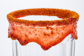 Glass garnished  with chamoy and chili powder for Mexican michelada
