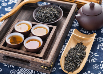 cup of tea and teapot on wooden table