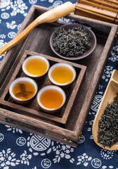 cup of tea and teapot on wooden table