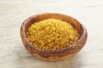 Raw bulgur in the bowl
