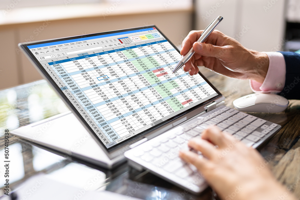 Poster analyst employee working on spreadsheet