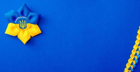 Blue yellow background. Ukrainian flower trident symbol isolated on blue. Love Ukraine concept.