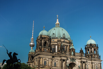 Fototapeta na wymiar Berlin Cathedral in the center of the capital of Germany. European architecture against the blue sky.