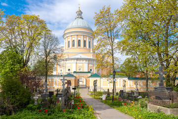 Sunny May day on the old St. Nicholas cemetery. View of Trinity Cathedral. Alexander Nevsky Lavra, Saint Petersburg