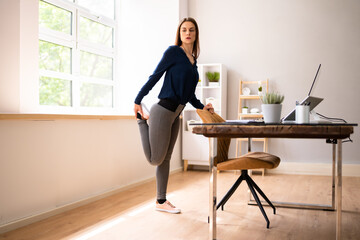 Young Businesswoman Doing Yoga