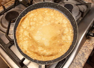 Pancakes from liquid dough are fried