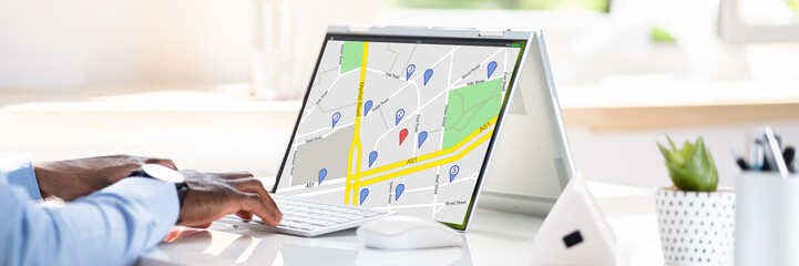 Man Browsing GPS Map On Laptop