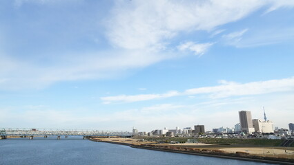 Fototapeta na wymiar Arakawa river and Adachi city sky