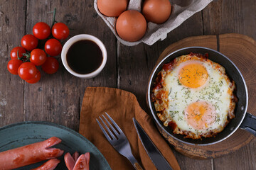 Breakfast with fried eggs and sausages