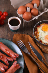 Breakfast with fried eggs and sausages
