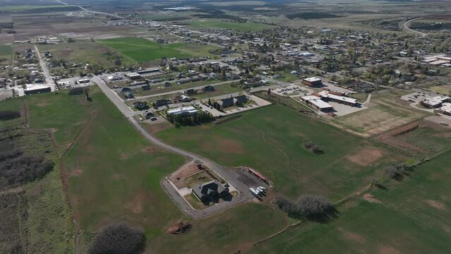 Aerial Monticello Utah city church part 1. Settled in July 1887 by pioneers from The Church of Jesus Christ of Latter-day Saints.  Uranium mine and refinery mill boom from the late 1940s.
